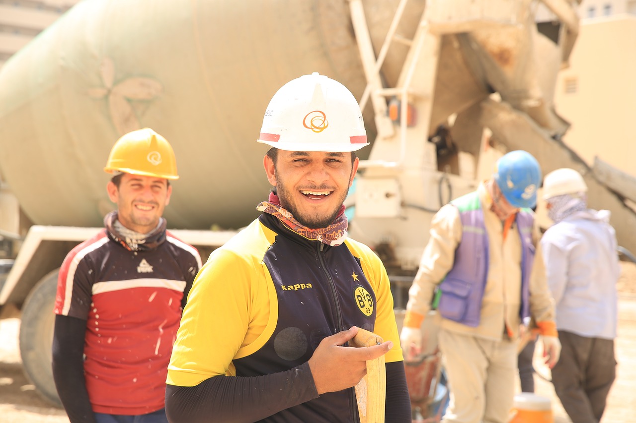 Managing Field Workers in Your Construction Business - happy concreters on site